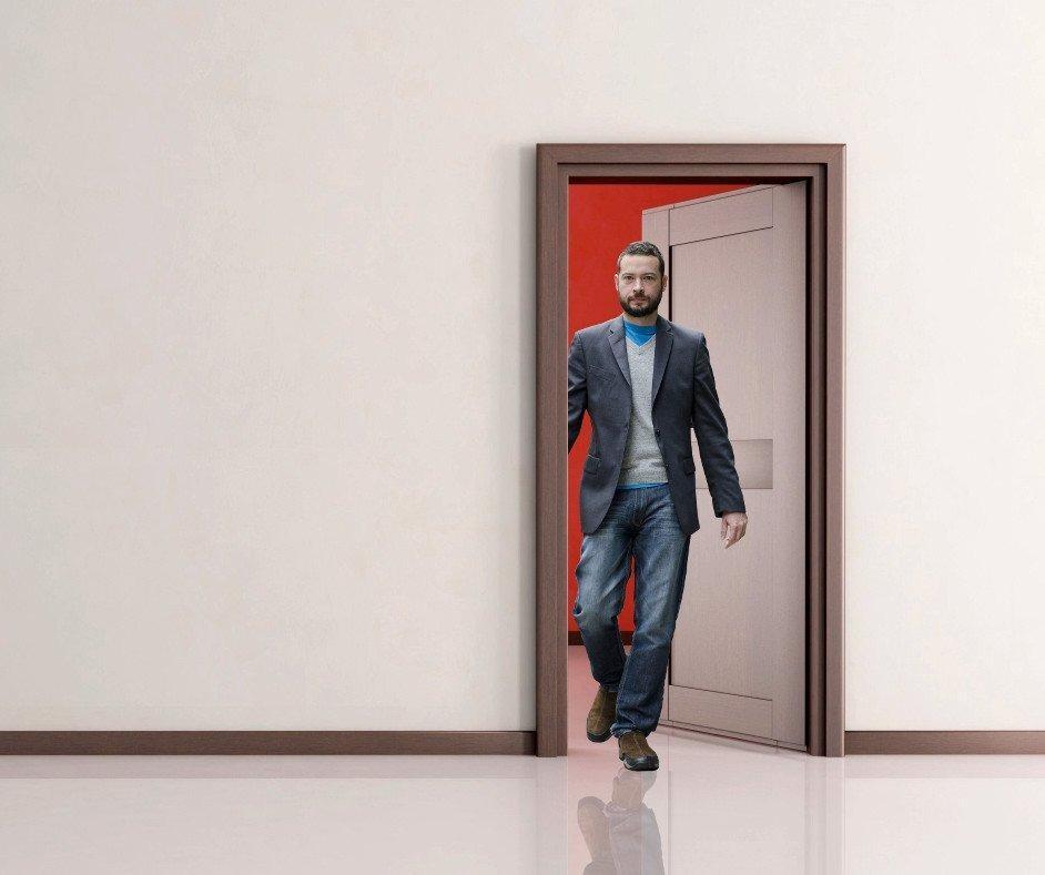 Man-walking-through-the-doorway_